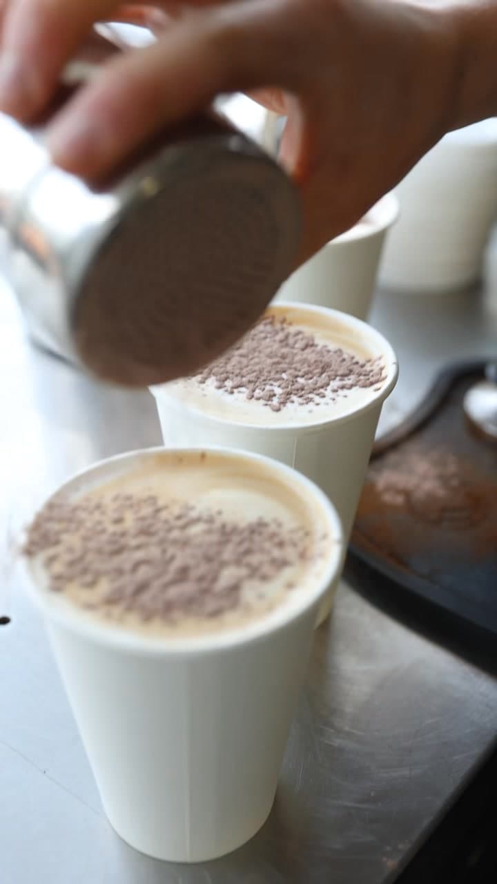 Hot chocolates being dusted with chocolate at the Arlo & Co van