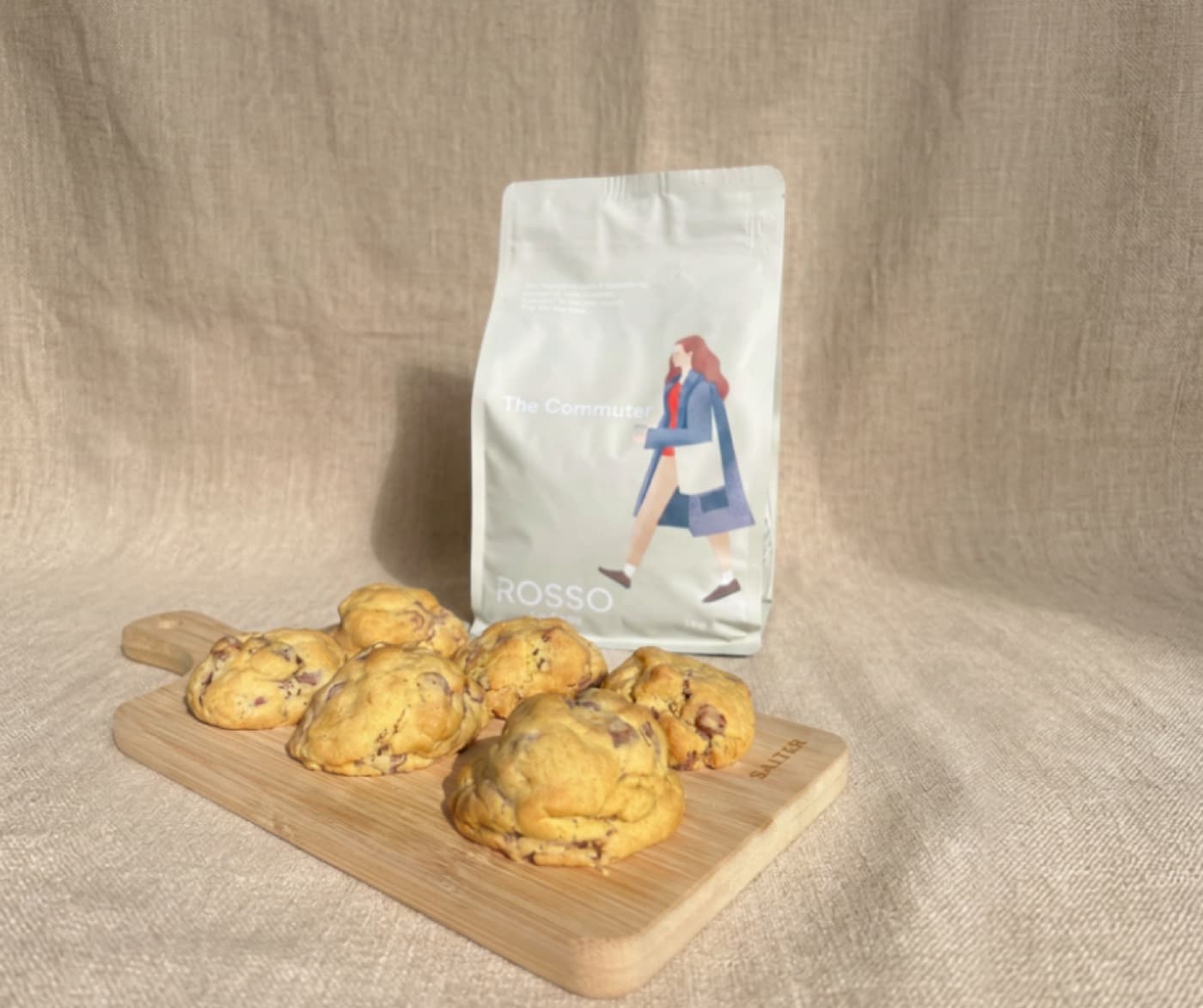 Mini loaded choc chip cookies beside a bag of Rosso coffee beans